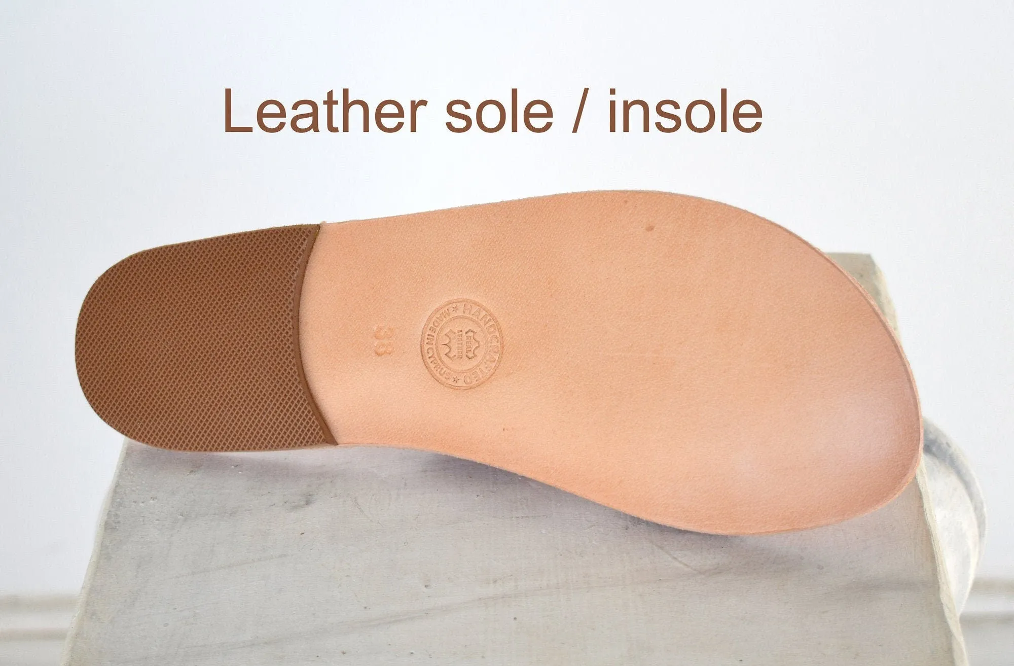 Leather sandals with wings